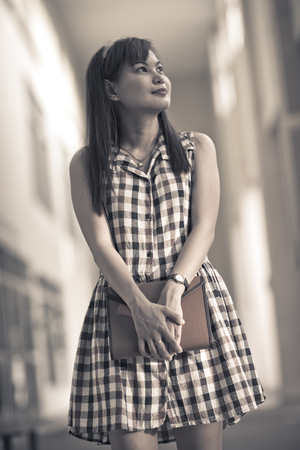 Portrait of smiling woman hold bookの写真素材