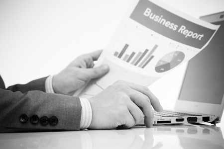 Businessman analyzing investment charts with laptop. Accountingの写真素材