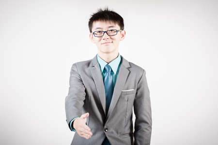 Successful young business man of Asian, full length portrait isolated on white.の写真素材