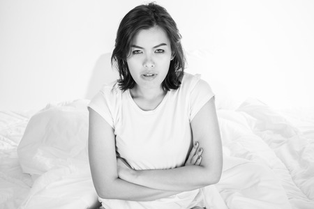 Portrait of a beautiful young woman in bedの写真素材