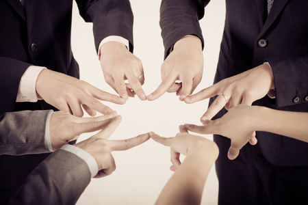 Business group with hands together - teamwork conceptsの写真素材