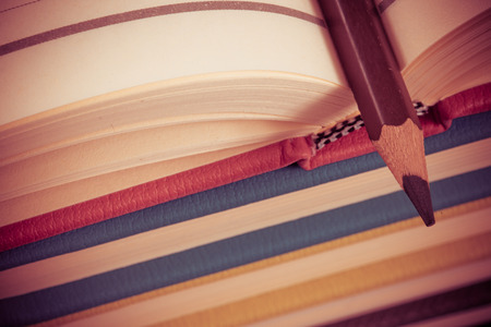 Close-up of open book and penの写真素材