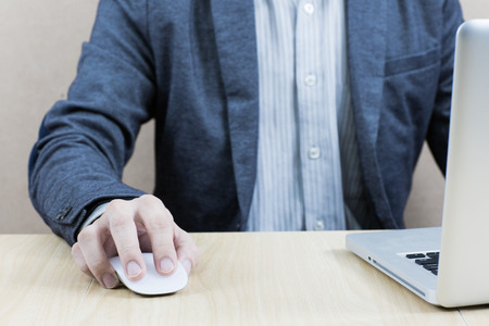 Hands of a man working with laptopの写真素材