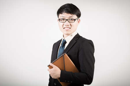 Successful young business man of Asian, full length portrait isolated on white.の写真素材