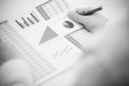 Businessman analyzing investment charts with laptop. Accountingの写真素材