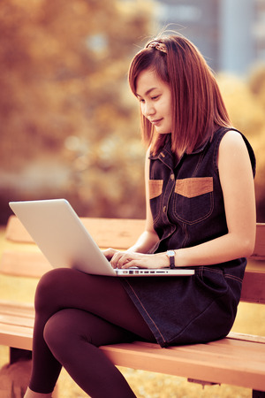 Woman using laptop indoor.close-up handの写真素材
