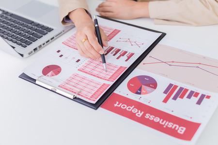 woman hand with business reportの写真素材