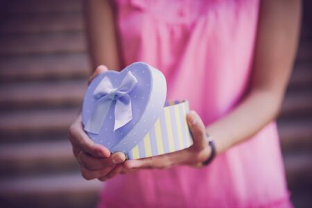 Woman hands holding a giftの写真素材