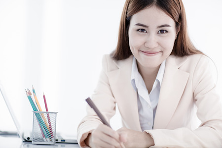 young asian businesswoman working in officeの写真素材