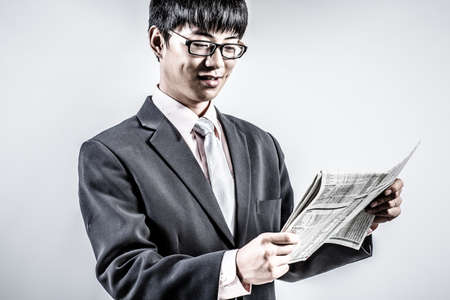 Successful young business man of Asian, full length portrait isolated on white.の写真素材