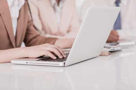 Business people discussing the charts and graphs showing the results of their successful teamworkの写真素材