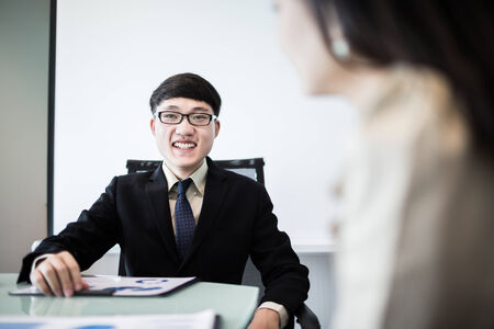 Successful young business executives meeting at the office.Asianの写真素材