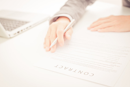 Business man signing a contractの写真素材