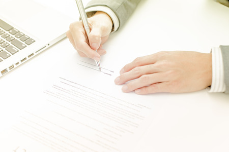 Business man signing a contractの写真素材