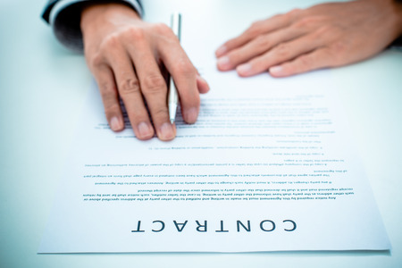 Business man signing a contractの写真素材