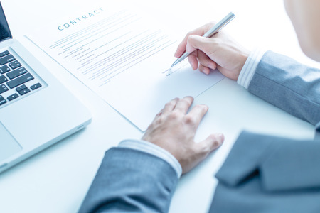 Business man signing a contractの写真素材