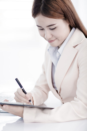young asian businesswoman working in officeの写真素材
