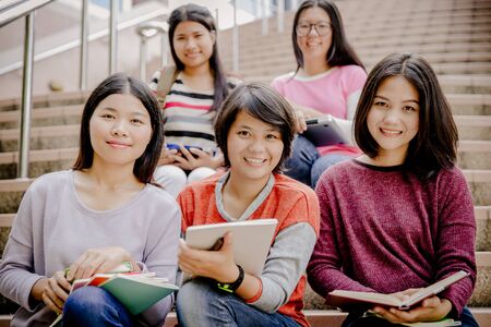 group of happy teen high school students outdoorsの写真素材