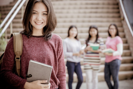 group of happy teen high school students outdoorsの写真素材