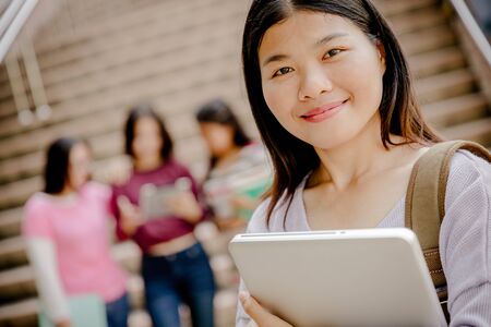 group of happy teen high school students outdoorsの写真素材