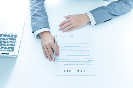 Business man signing a contractの写真素材