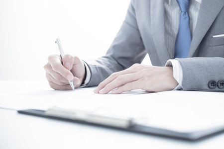 Business man signing a contractの写真素材