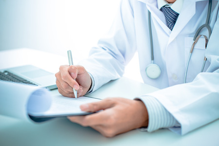 Close-up of a medical worker with laptopの写真素材