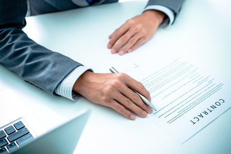 Business man signing a contract