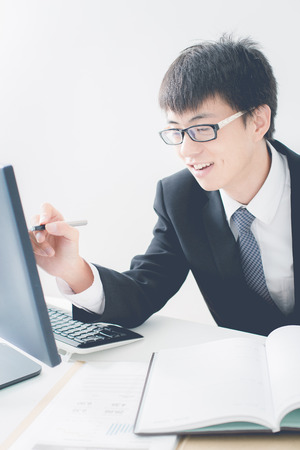 Businessman analyzing investment charts. Accountingの写真素材