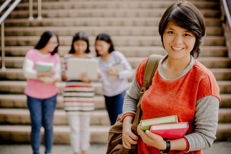 group of happy teen high school students outdoorsの写真素材