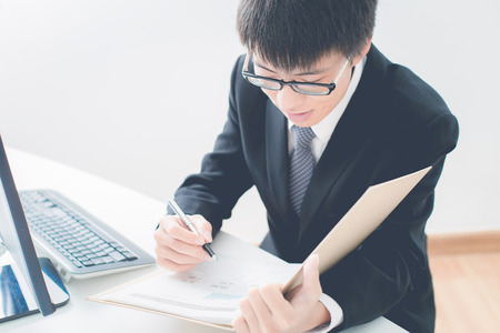 Businessman analyzing investment charts. Accountingの写真素材