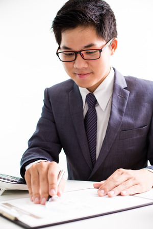 Businessman analyzing investment charts. Accountingの写真素材