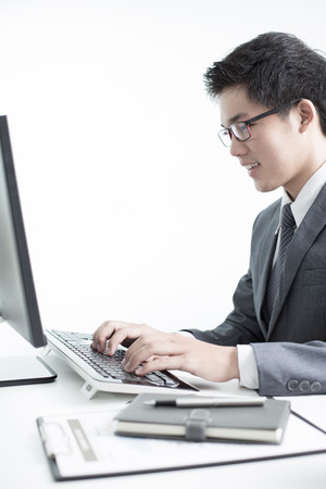 Handsome businessman working with laptopの写真素材
