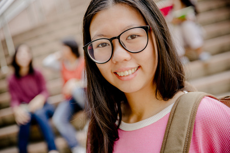 group of happy teen high school students outdoorsの写真素材