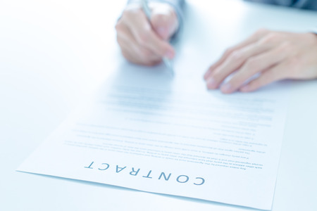 Business man signing a contractの写真素材