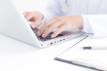 Close-up of a medical worker with laptopの写真素材