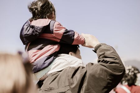 Father Giving Daughter Piggyback Rideの写真素材
