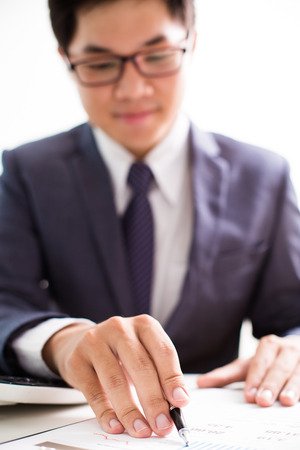 Businessman analyzing investment charts. Accountingの写真素材