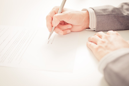 Business man signing a contractの写真素材