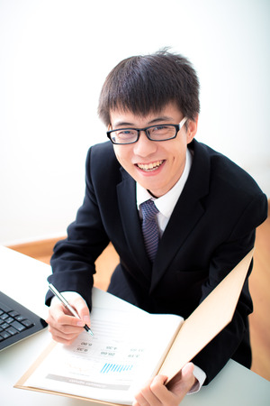 Businessman analyzing investment charts. Accountingの写真素材