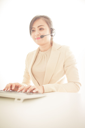 businesswoman talking on the phone while workingの写真素材