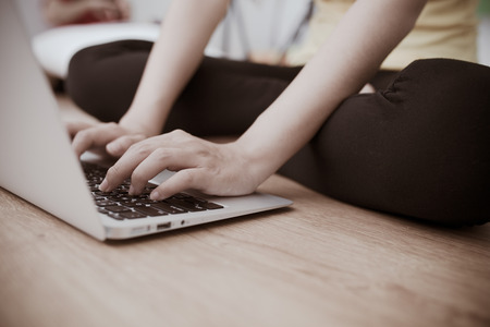 Woman using laptop at homeの写真素材