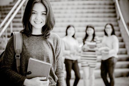 Group of happy teen high school students outdoorsの写真素材