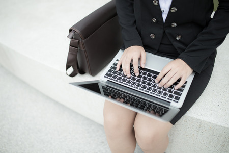 Successful businesswoman working at laptopの写真素材