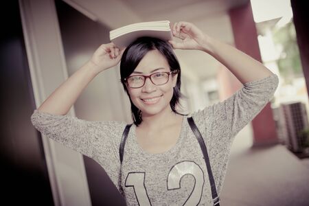 attractive female college student sittingの写真素材