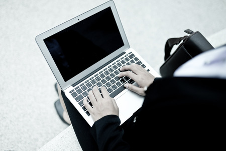 Successful businesswoman working at laptopの写真素材