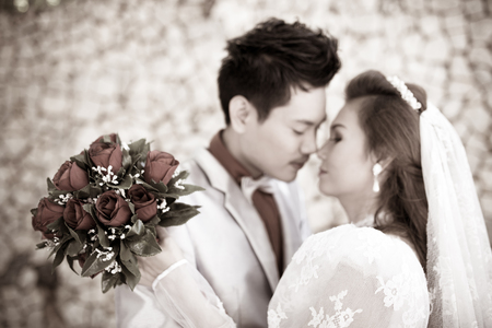 Wedding shot of bride and groom in parkの写真素材