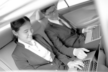 Young business team working together in the car