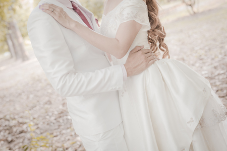 Wedding shot of bride and groom in parkの写真素材