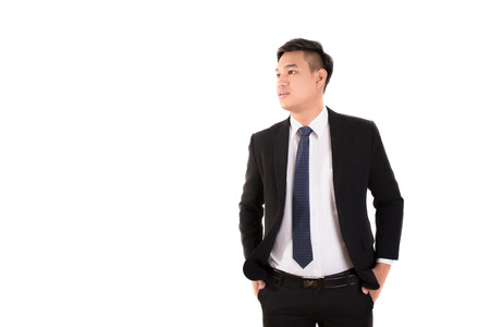 Portrait of young happy smiling business man, isolated over white backgroundの写真素材